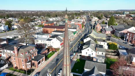 drone shot revealing main street and neighborhood of mount joy downtown, usa