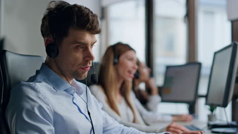 Stressed-call-center-worker-speaking-headset-closeup.-Annoyed-man-specialist