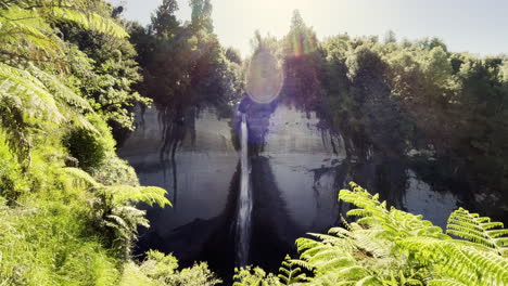 sunflare over mount damper falls in taranaki, north island of new zealand