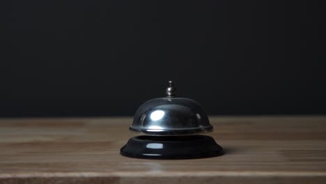 ringing an old bell on front desk