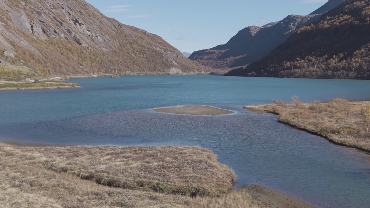 Glacier lake in Jotunheimen National Park. Autumn colors. Drone footage