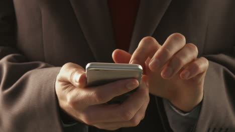 Businessman-using-his-smartphone