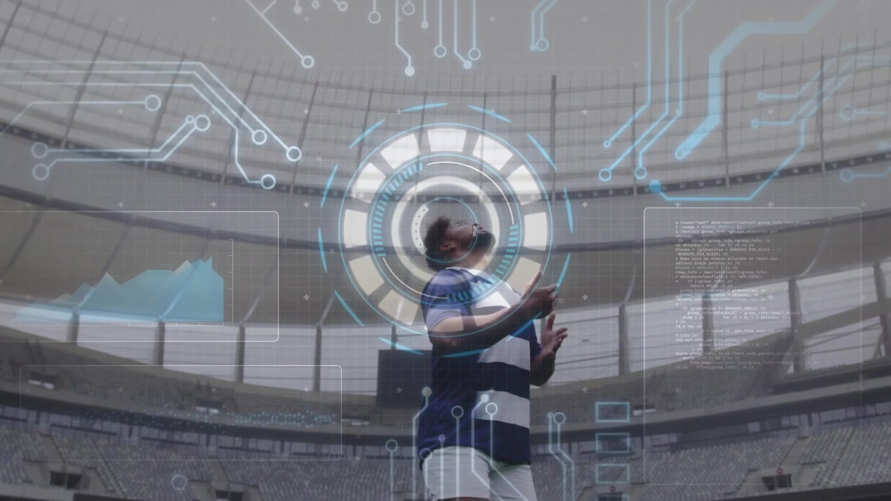 Male rugby player gripping ball and activating HUD in stadium while analyzing data via charts