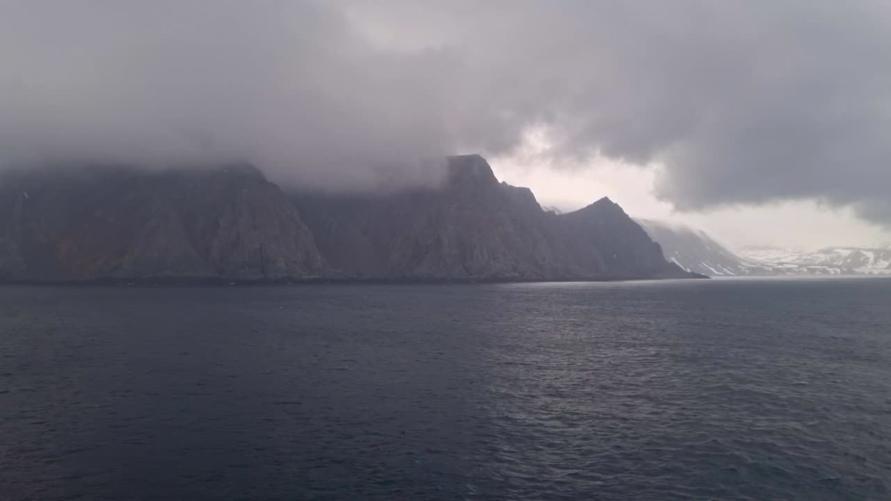 The view of clouds and mist from the deck of a cruise ship sailing along the coast of Norway