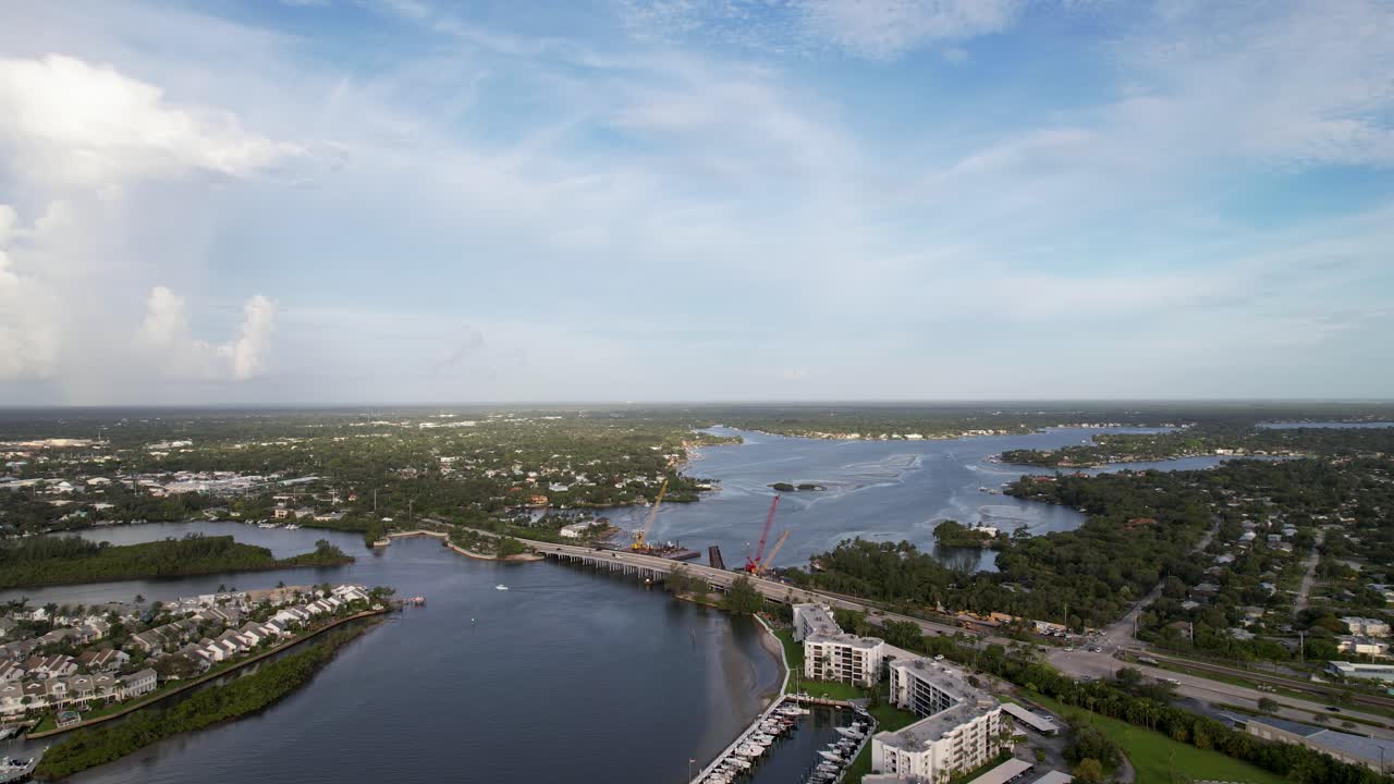 Aerial view of Jupiter Florida capturing coastal infrastructure, residential layouts, and reflective waters beneath soft light