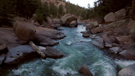 Aerial-drone-cinematic-Colorado-down-the-river-fisherman-paradise-Deckers-Cheesman-Canyon-Evergreen-Conifer-Boulder-shaded-mountainside-forest-peaceful-water-boulder-rocks-forward-movement-flight-4k