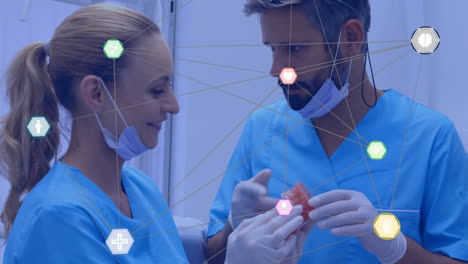 medical network connections animation over dental professionals examining model