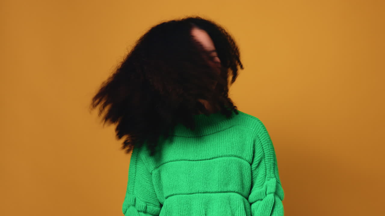 Woman with Afro and Green Sweater
