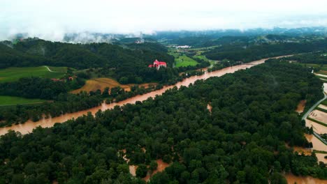 Horrific-Aerial-4K-Drone-footage-of-Castle-Borl-and-flooded-villages-in-Podravje,-Slovenia,-during-August