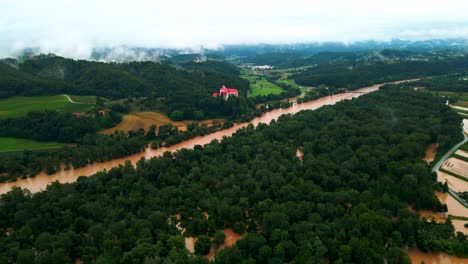 horrific aerial 4k drone footage of castle borl and flooded villages in podravje, slovenia, during august