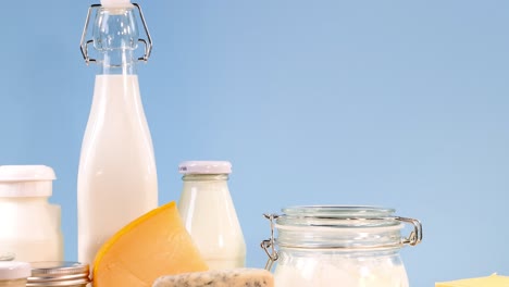 various dairy items displayed against a blue backdrop