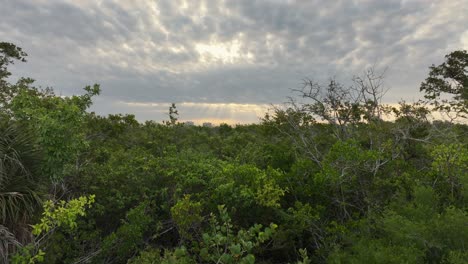 Sun-beaming-through-clouds-near-Bonita-Springs-in-Florida