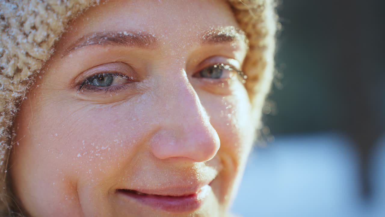 Woman's face covered in frost and snow
