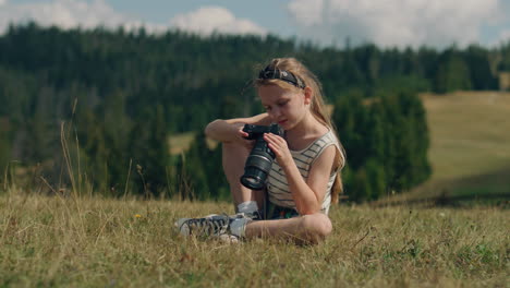 girl taking photos in the mountains