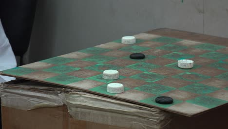 Two-men-play-checkers-in-a-barber-shop-in-havana-Cuba-1