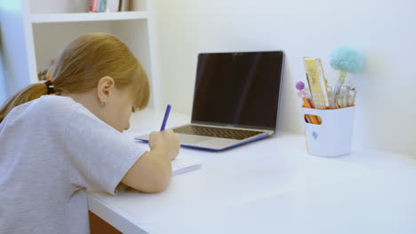 child studying at home