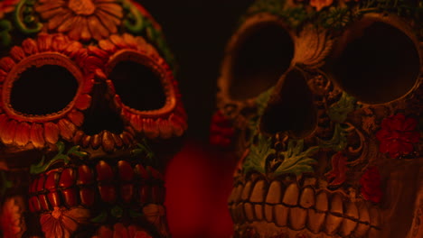 close up on still life of decorated skulls celebrating mexican holiday of dia de muertos or day of the dead 3