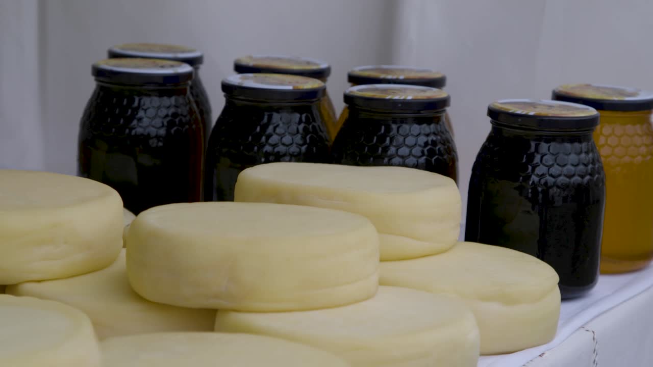 Delicious hand made organic cheese and organic honey sold at a winter market in Portugal