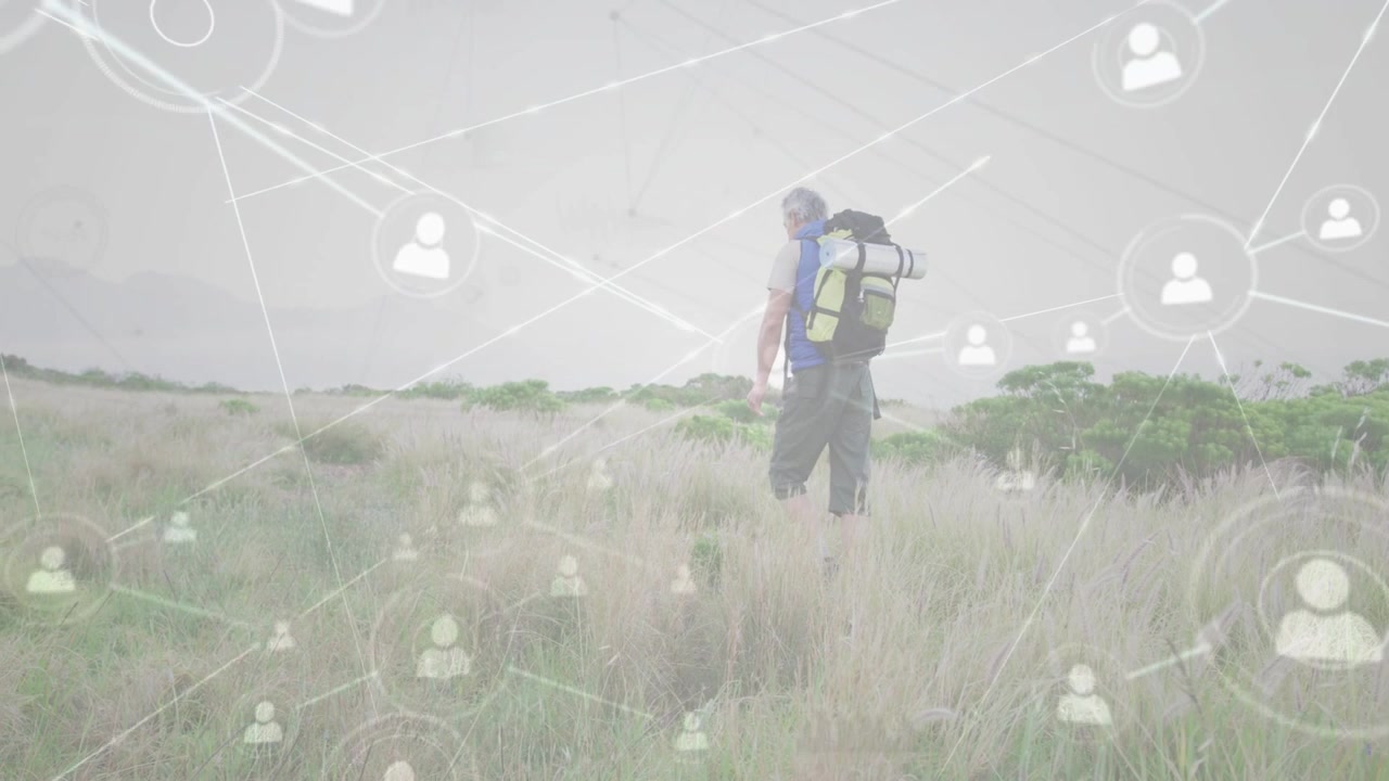 Vertical video: Stepping man with pack mat, shirt heading through field as icons rising, copy space