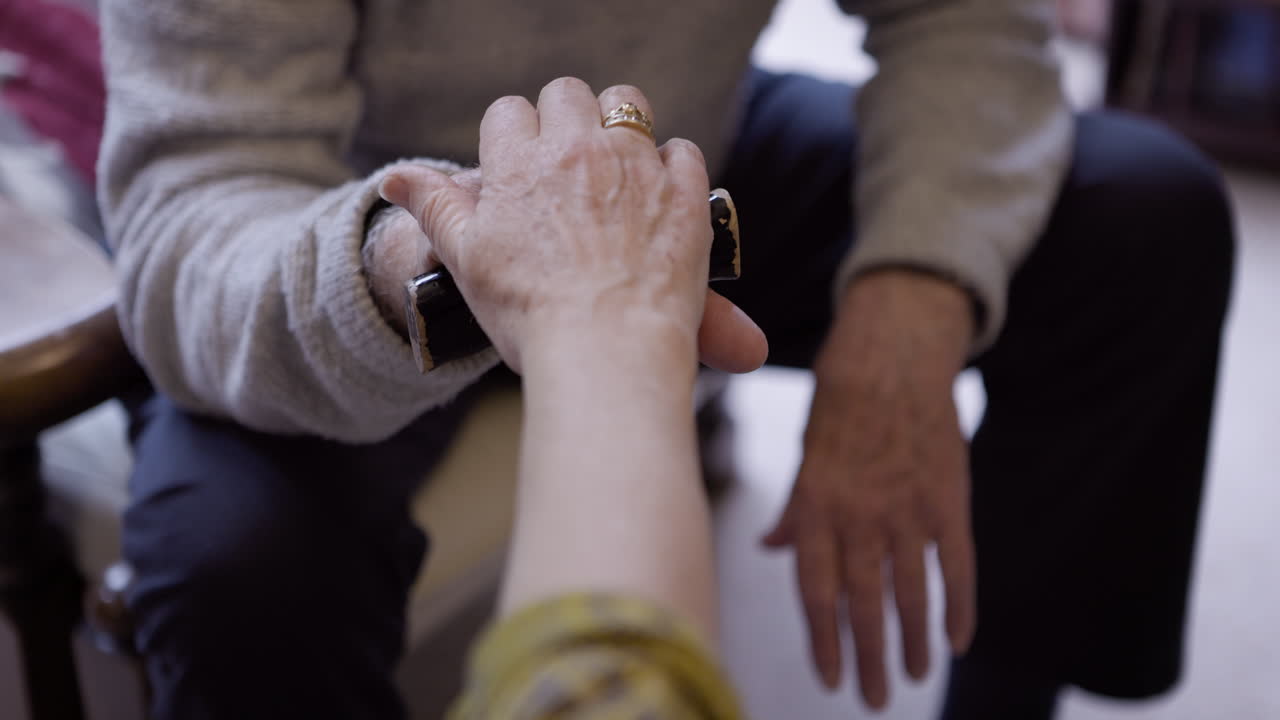 Elderly person receiving help
