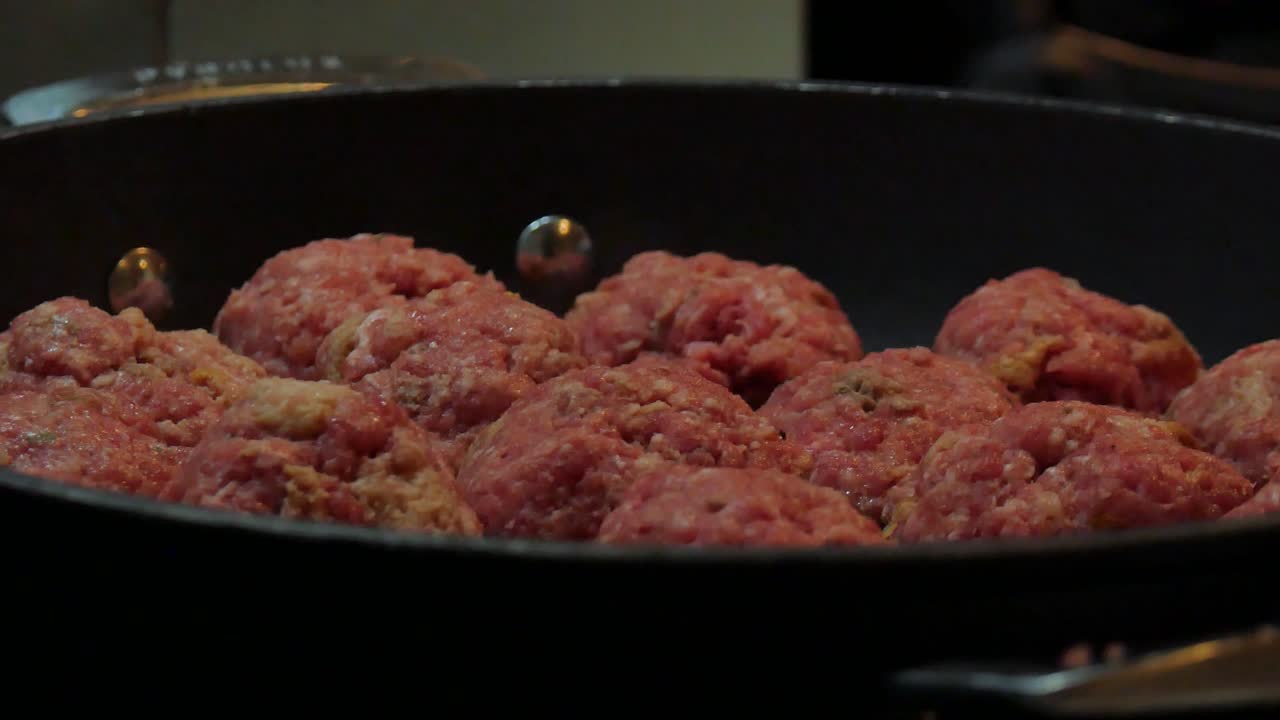 Meatballs in a black saucepan