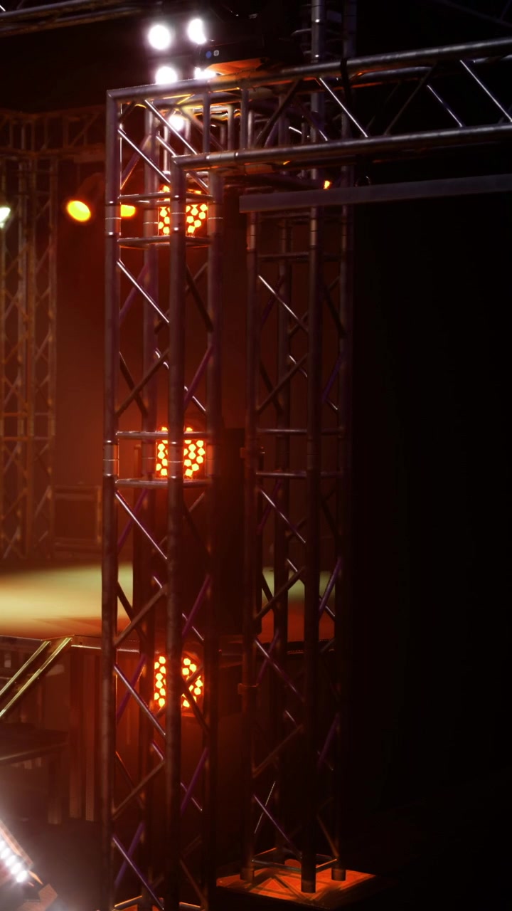 Lighting setup on stage for concert at venue during evening event