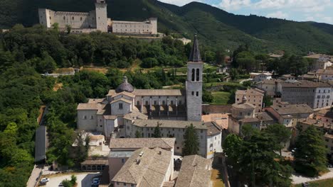 striking aerial drone shot of santa maria assunta cathedral in spoleto, circling