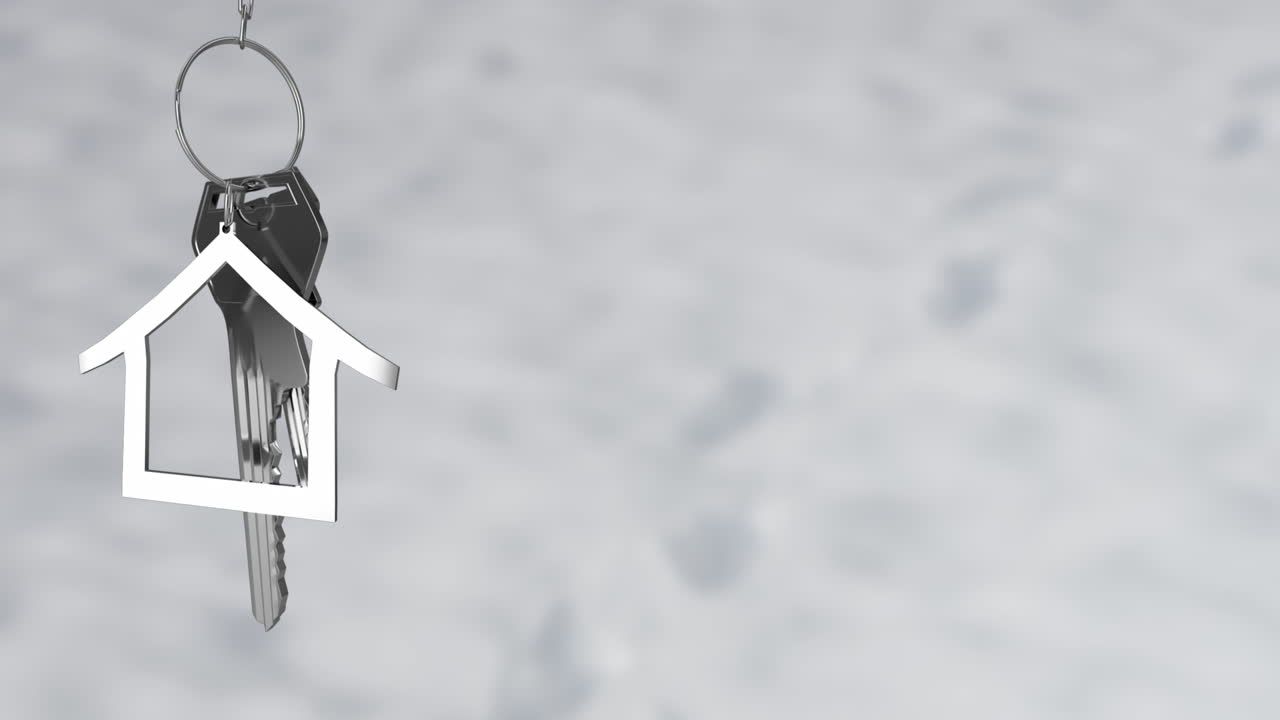 animación de llave de plata con llavero de la casa en fondo gris.