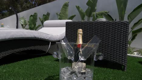 bottle-of-champagne-next-to-sunbeds-in-a-bucket-of-ice-in-Spain