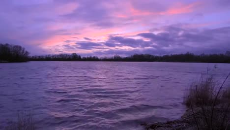 time lapse or timelapse footage of an evening or dusk yellow, orange and red sky with clouds moving