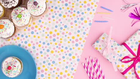 party accessories and decoration with cup cakes on the table. stop motion