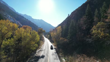 following a truck down the valley leaving a ski resort. navigating the trees and winding down the peaceful road