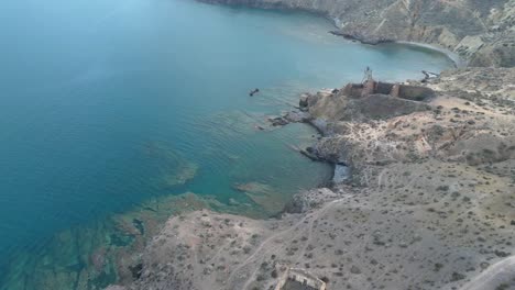 fly over an iron mine and an old port that remains only ruins in northern algeria