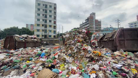 pile of street garbage beside road in bangladesh