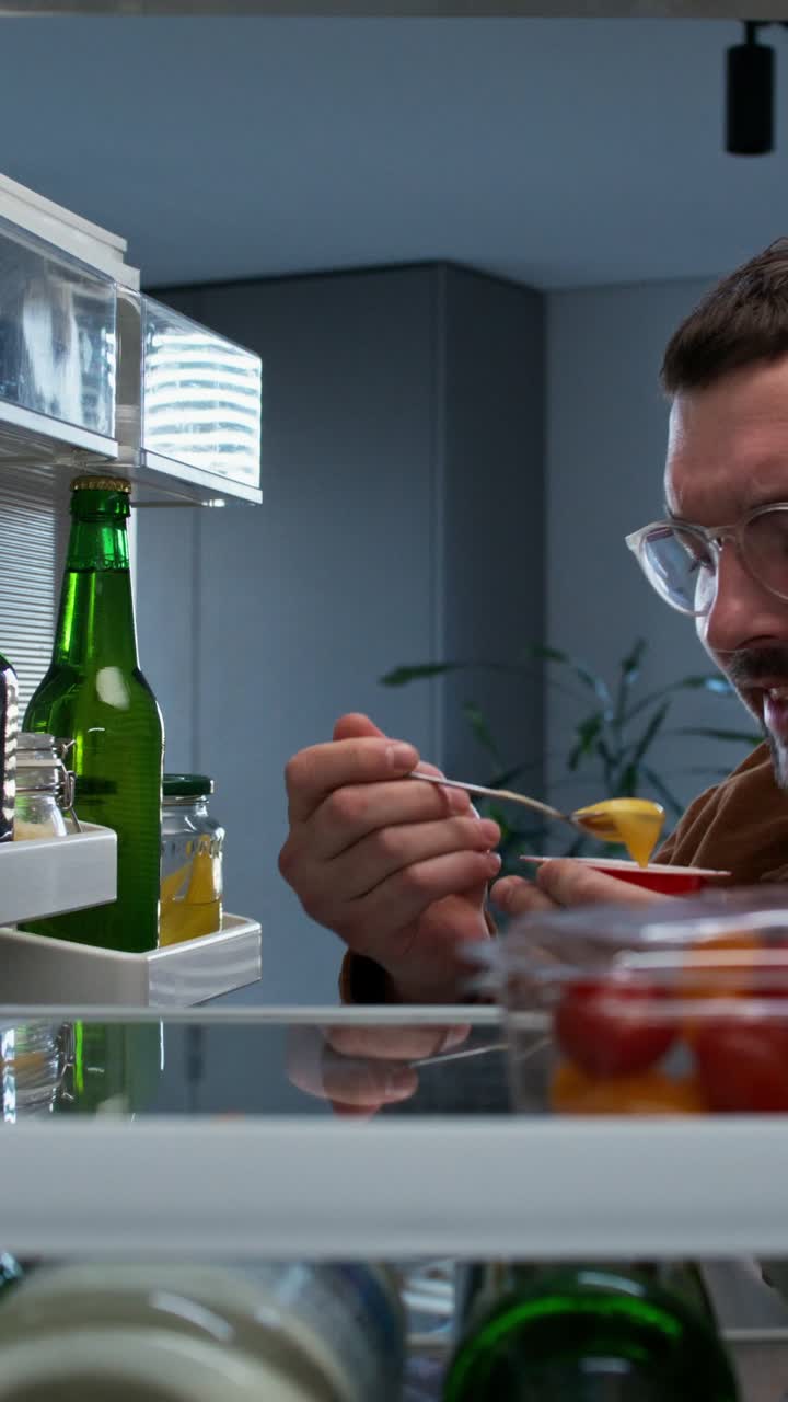 Person looking inside a refrigerator