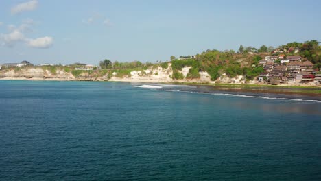 the surf spot of bingin at the cliffs of uluwatu during a sunny day