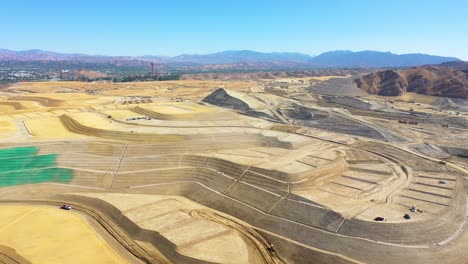 Aerial-over-a-massive-vast-giant-tract-home-contruction-project-development-in-the-hills-above-Santa-Clarita-California-suggests-Los-Angeles-urban-sprawl-7