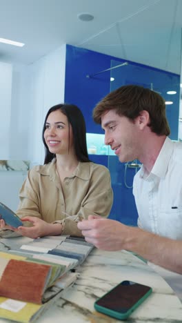 people looking at fabric samples