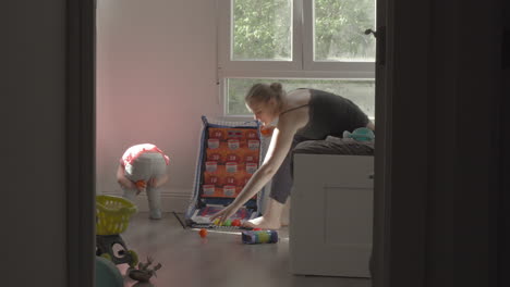 playful little girl with mum at home