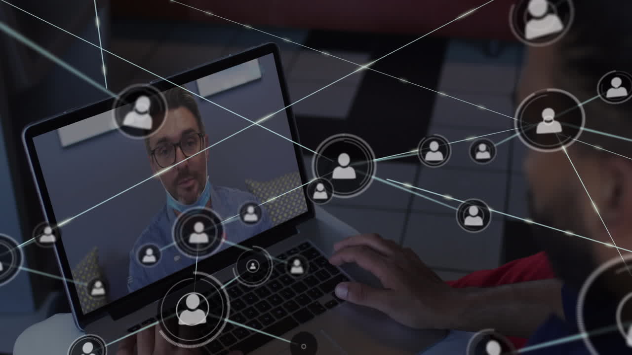 Animation of network of profile icons over rear view of biracial man having a video call on laptop