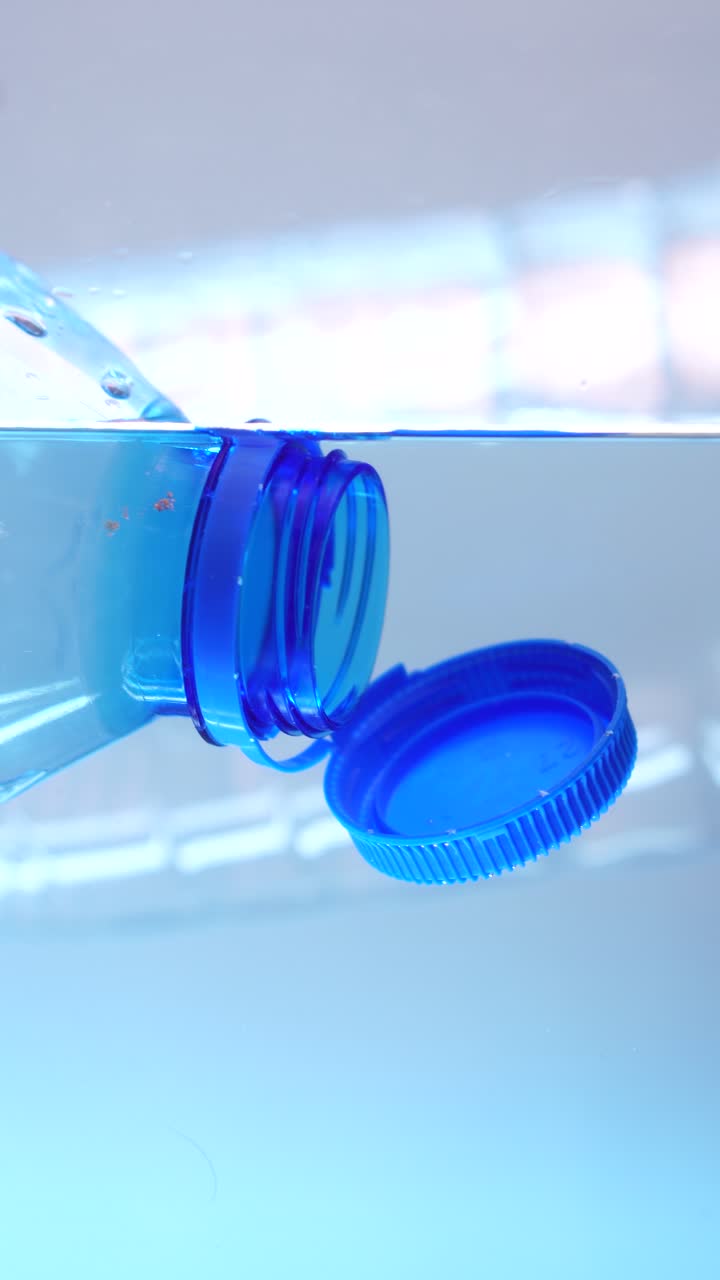 Plastic Bottle Submerged in Water: A Symbol of Plastic Pollution