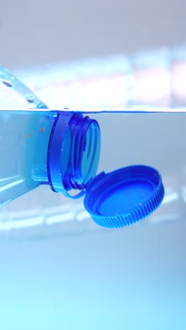plastic bottle submerged in water: a symbol of plastic pollution