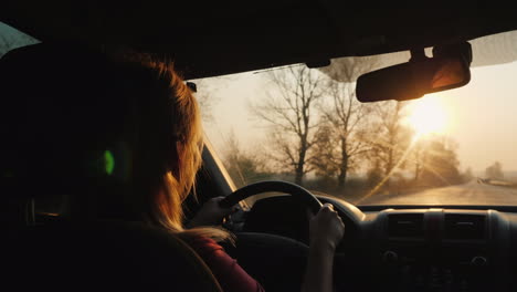 silhouette of a female driver driving a car