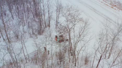 Clearing-snow-on-a-rural-property-with-a-wheeled-bobcat