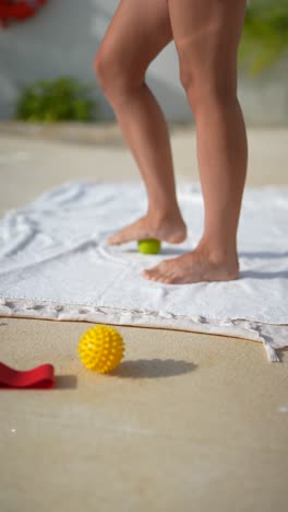 foot massage exercise on a towel