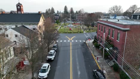 american small town with roundabout and playground in center at sunset