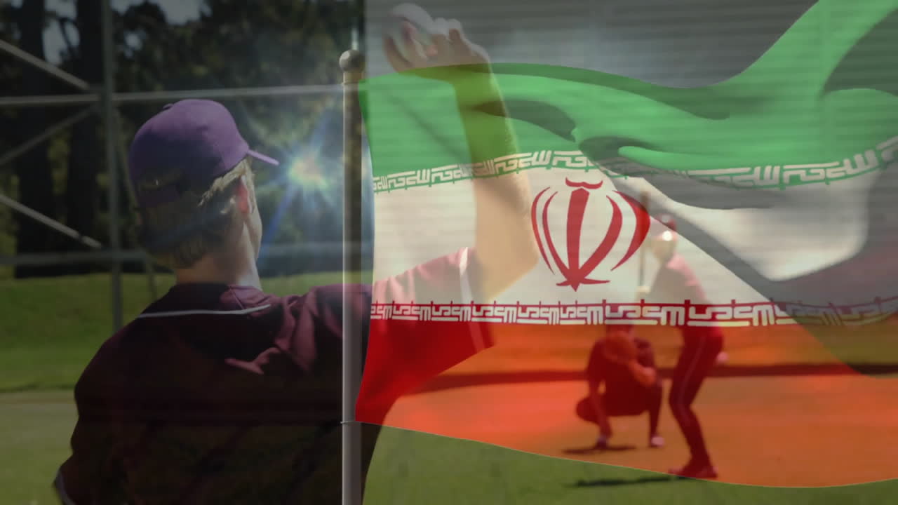 Pitchar baseball, spelare framför en iransk flagga som vajar i bakgrunden