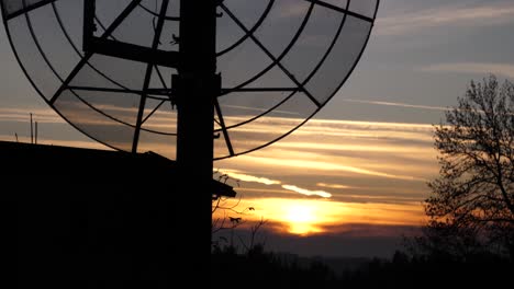 sunset with a transmission mast in foreground