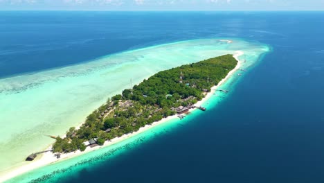 Hyper-lapse-of-tropical-island-and-coral-reef-from-above-Mataking-Island-in-Malaysia