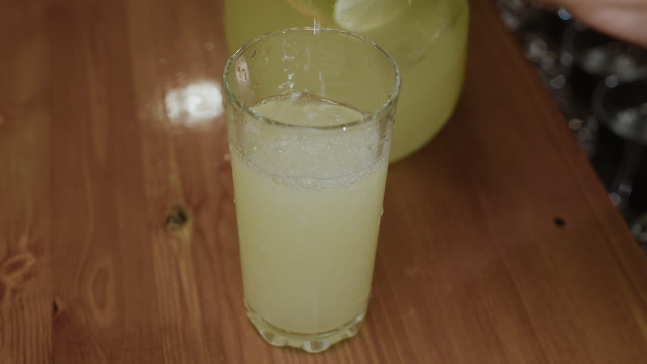 Pouring Lemonade into a Glass